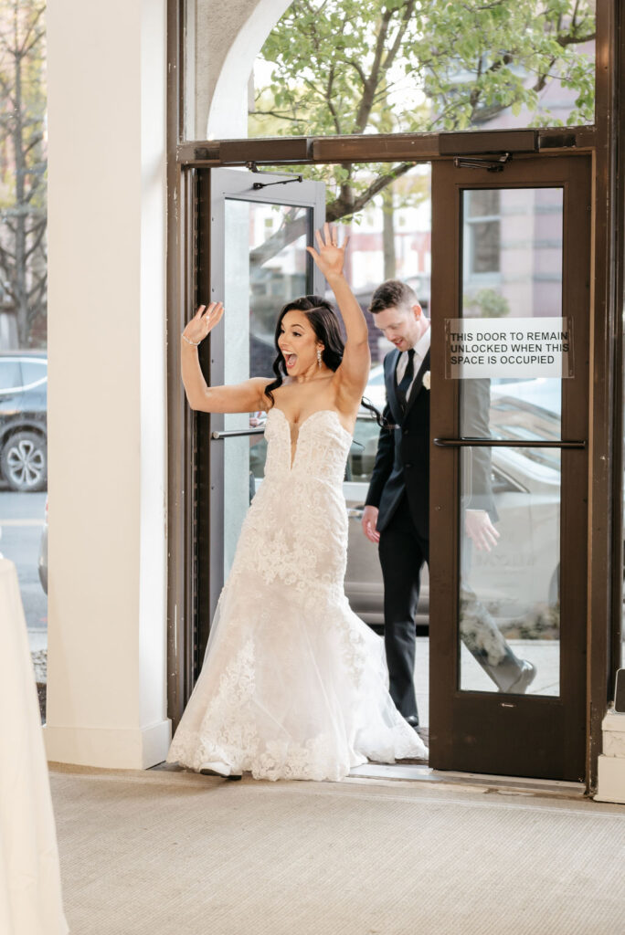 a couple entering their historic wedding venue for their reception